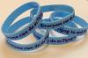 1Thing Wristband, blue band with purple text reading everyone can do one thing to end dv